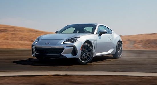 The 2022 Subaru BRZ driving on a road.