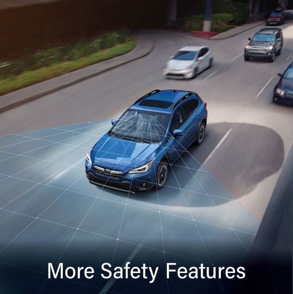 A Subaru Crosstrek in blue with the words &ldquo;More Safety Features&ldquo;. | Dean Team Subaru in Ballwin MO