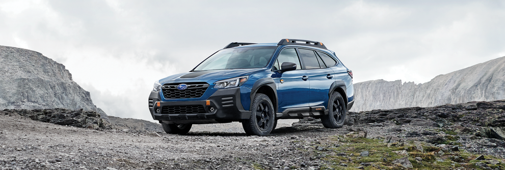 A 2023 Outback Wilderness parked in the mountains. | Dean Team Subaru in Ballwin MO